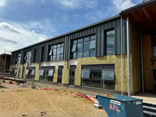 Click Here To Enlarge This Photo Of Ash & Lacy Ashzip 400mm flat pan built up aluminium Standing Seam Roofing & Cladding System in Slate Grey for a private school in London