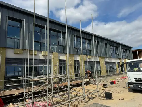 Click Here To Enlarge This Photo Of Ash & Lacy Ashzip 400mm flat pan built up aluminium Standing Seam Roofing & Cladding System in Slate Grey for a private school in London