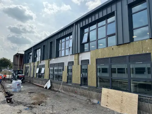 Click Here To Enlarge This Photo Of Ash & Lacy Ashzip 400mm flat pan built up aluminium Standing Seam Roofing & Cladding System in Slate Grey for a private school in London